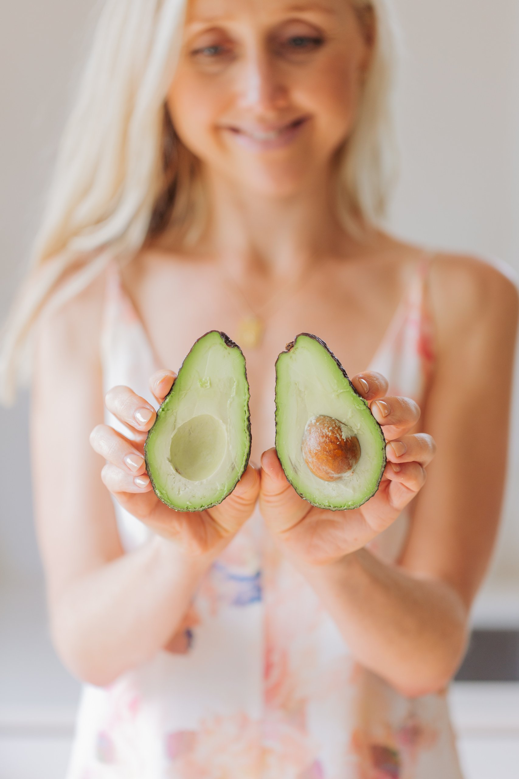 Buffy Ellen from Be Good Organics holding avocado. 3 Ways To Boost your Gut Health and Immunity.