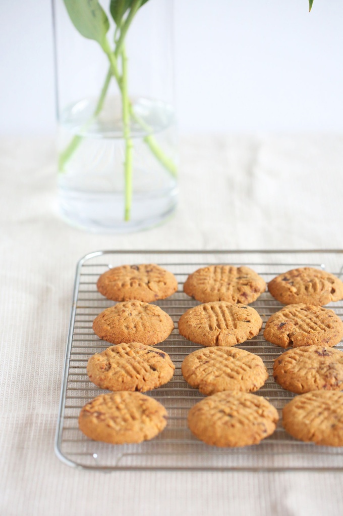 delicious dairy free chocolate chip cookies with walnuts on cooling rack