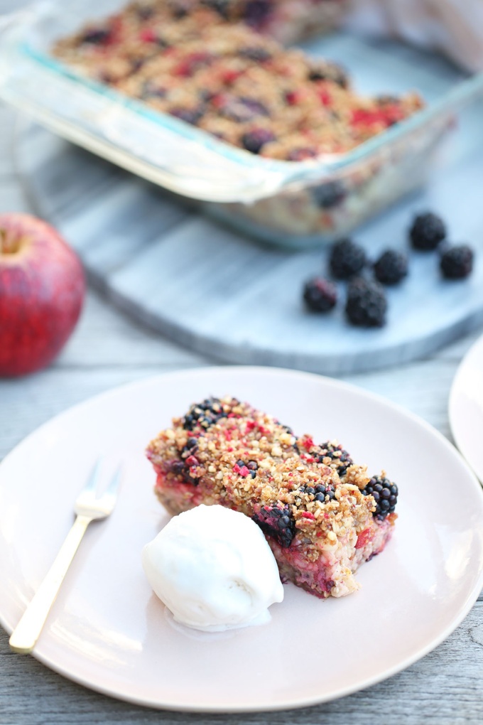 Vegan, gluten free apple and Blackberry Crumble with dollop of coconut yogurt and cute fork