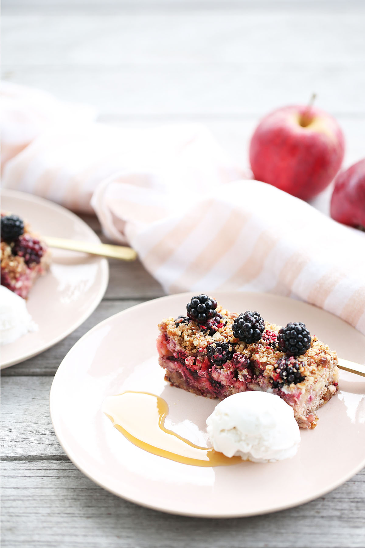 drizzle of organic apple syrup with apple and blackberry crumble and dolloped coconut yogurt 