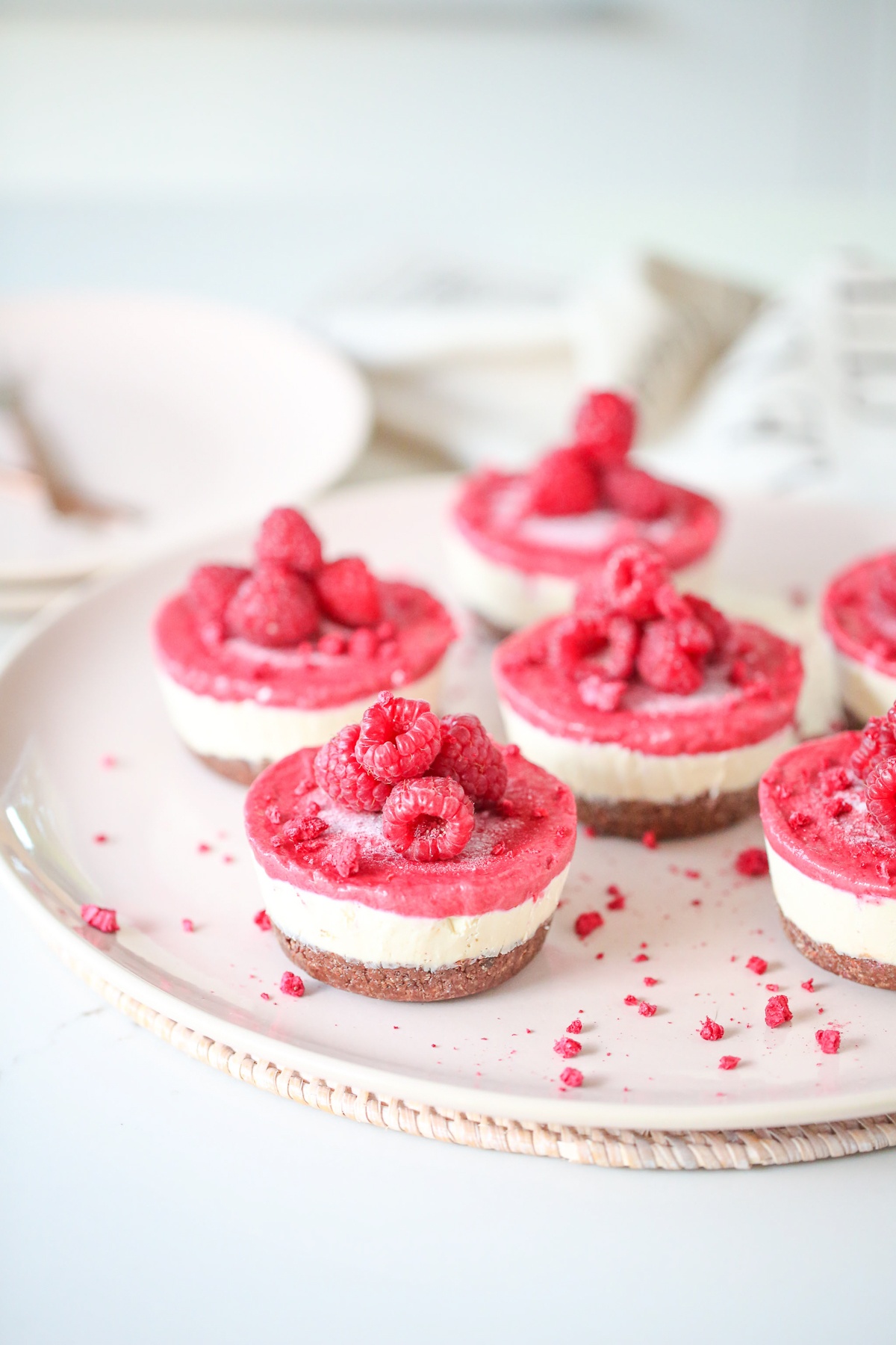 Close up of red and white vegan cheesecakes