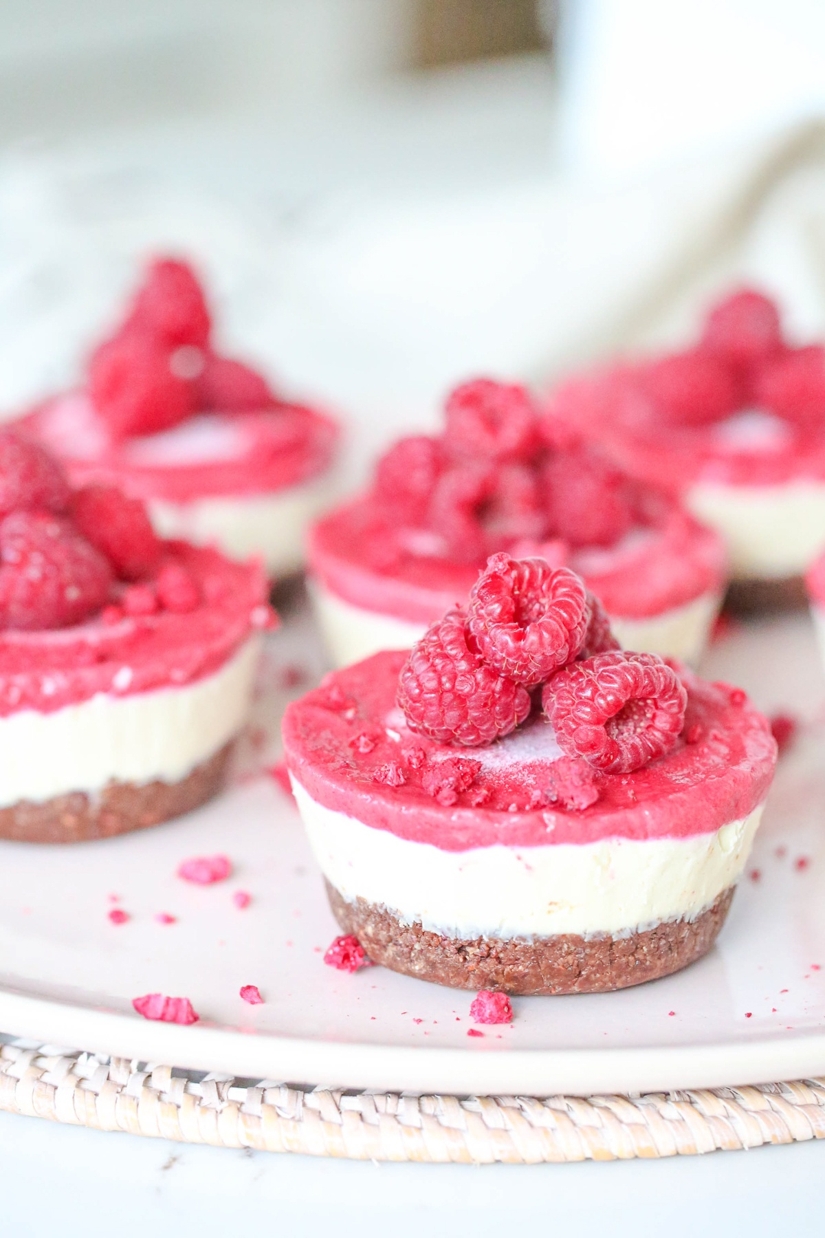 Close up of red and white vegan cheesecakes