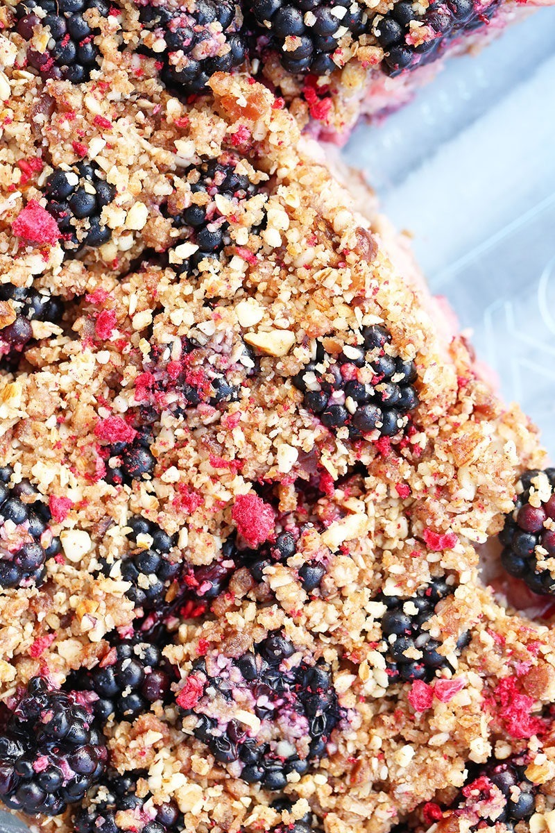 close up of raw, vegan apple and blackberry crumble 